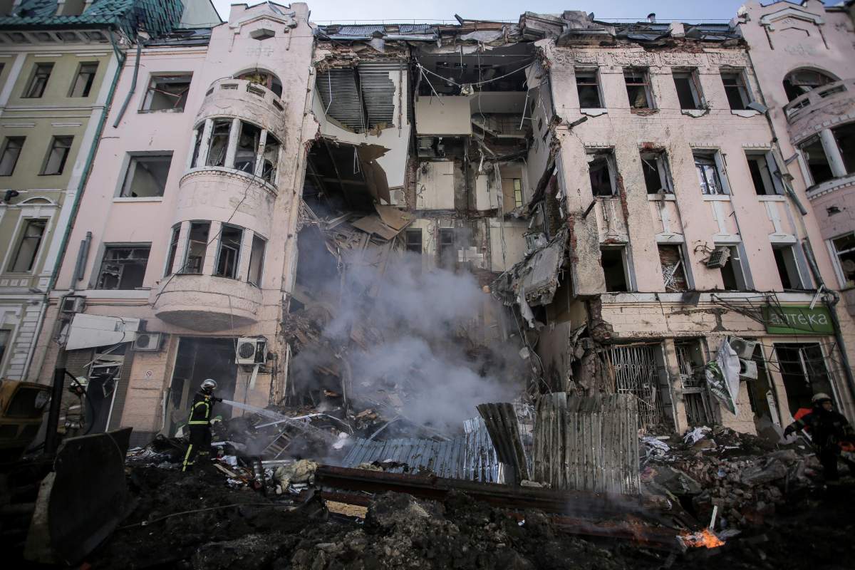 Firefighters extinguish an apartment house after a Russian rocket attack in Kharkiv, Ukraine’s second-largest city, Ukraine, Monday, March 14, 2022.