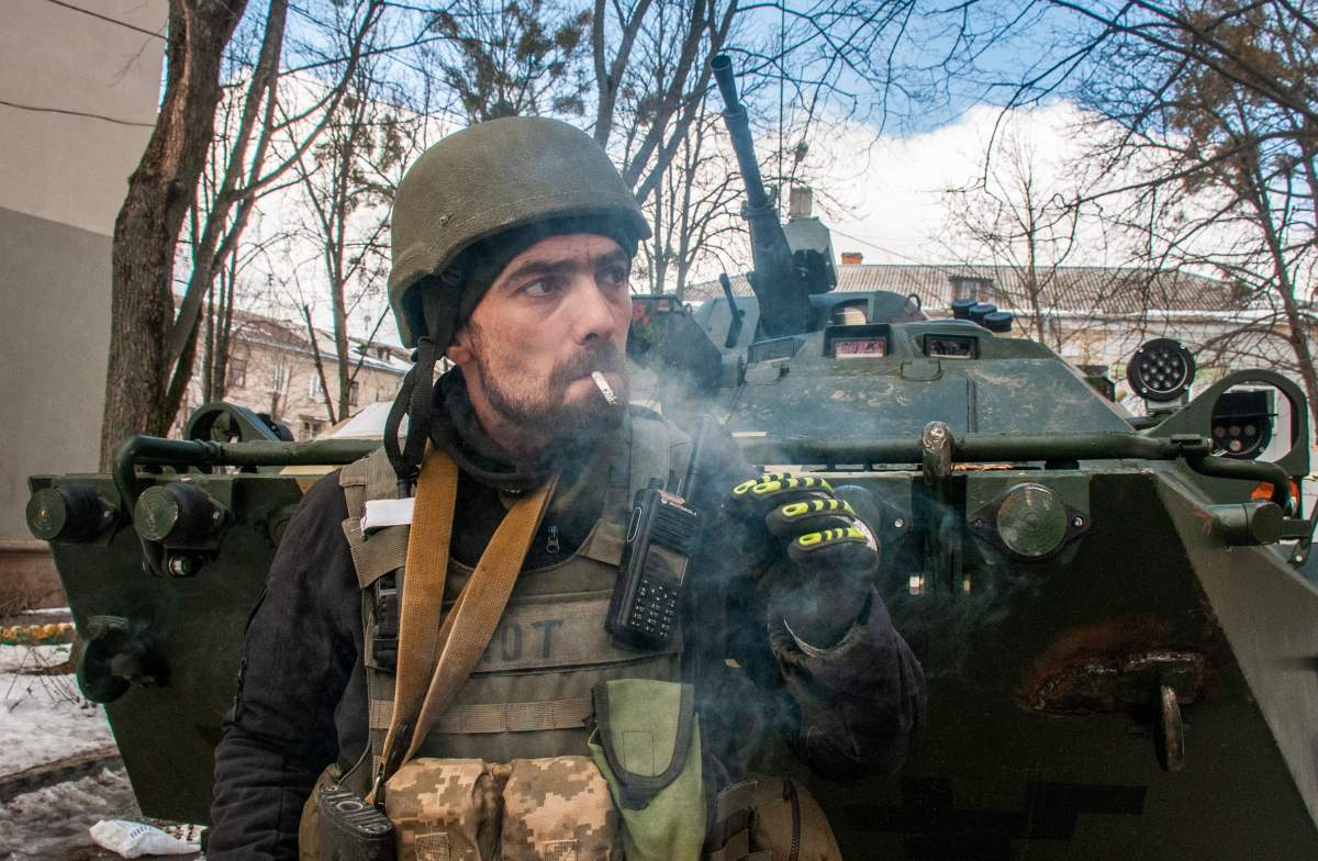 A volunteer of the Ukrainian Territorial Defense Forces smokes in Kharkiv, Ukraine, Wednesday, March 16, 2022.