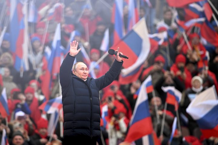 Russian President Vladimir Putin greets people after his speech at the concert marking the eighth anniversary of the referendum on the state status of Crimea and Sevastopol and its reunification with Russia, in Moscow, Russia, Friday, March 18, 2022.