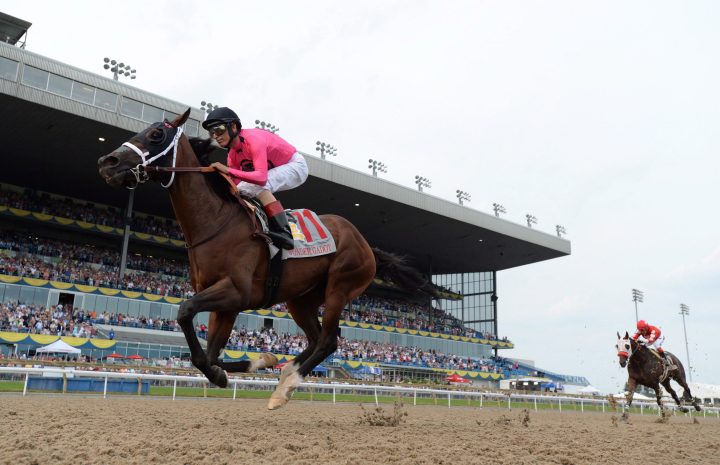 Wonder Gadot, with jockey John Velazquez aboard races towards victory during the Queen's Plate at Woodbine Racetrack in Toronto on Saturday, June 30, 2018. 