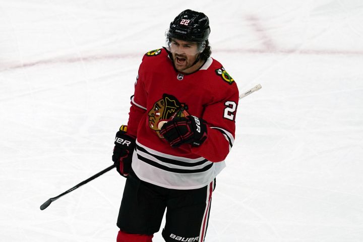 Chicago Blackhawks' Ryan Carpenter reacts after scoring a goal during the second period of an NHL hockey game against the Tampa Bay Lightning in Chicago, Thursday, March 4, 2021.