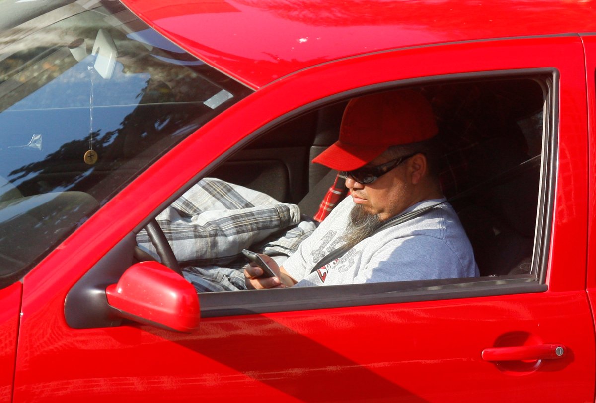 A file photo showing a driver using a cellphone. 