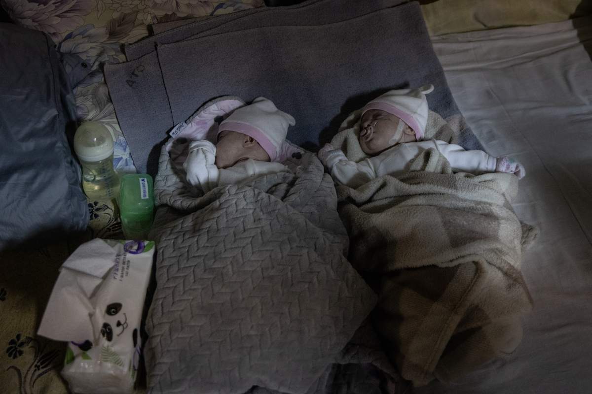 Newborn twin brothers sleep in a basement used as a bomb shelter at the Okhmadet children's hospital in central Kyiv, Ukraine, Monday, Feb. 28, 2022. (AP Photo/Emilio Morenatti)
