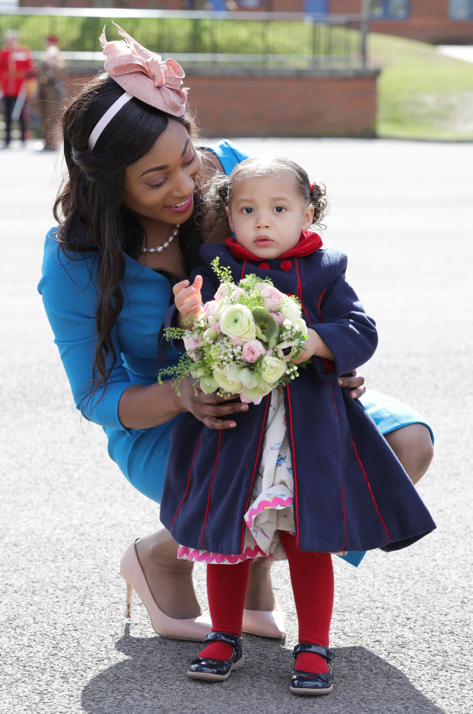 20-month-old Gaia Money and her mother, Lorraine Money attend the 1st Battalion Irish Guards' St. Patrick's Day Parade at Mons Barracks on March 17, 2022 in Aldershot, England.