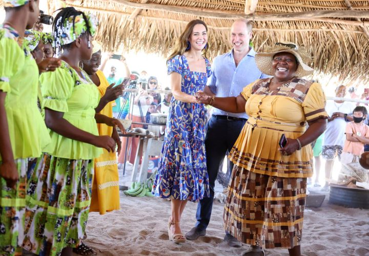 Catherine, Duchess of Cambridge and Prince William, Duke of Cambridge dance during a traditional Garifuna festival on the second day of a Platinum Jubilee Royal Tour of the Caribbean on March 20, 2022 in Hopkins, Belize.