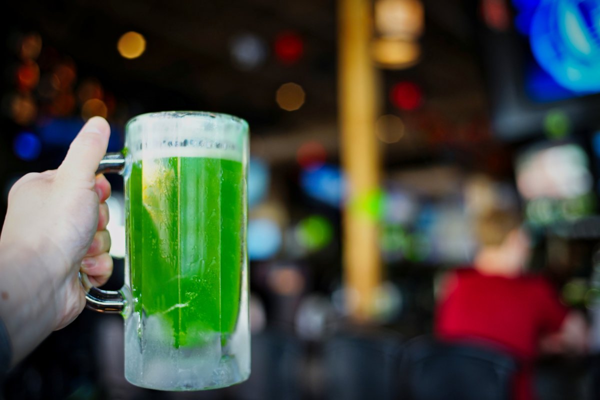 People celebrate St. Patrick Day with drinking green beer.