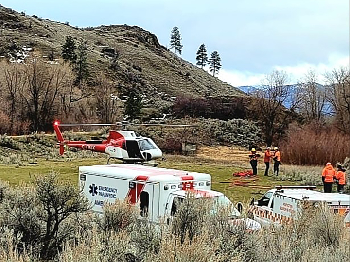 A photo showing the helicopter, an ambulance and rescue crews from Tuesday’s high-angle rescue near Osoyoos, B.C.