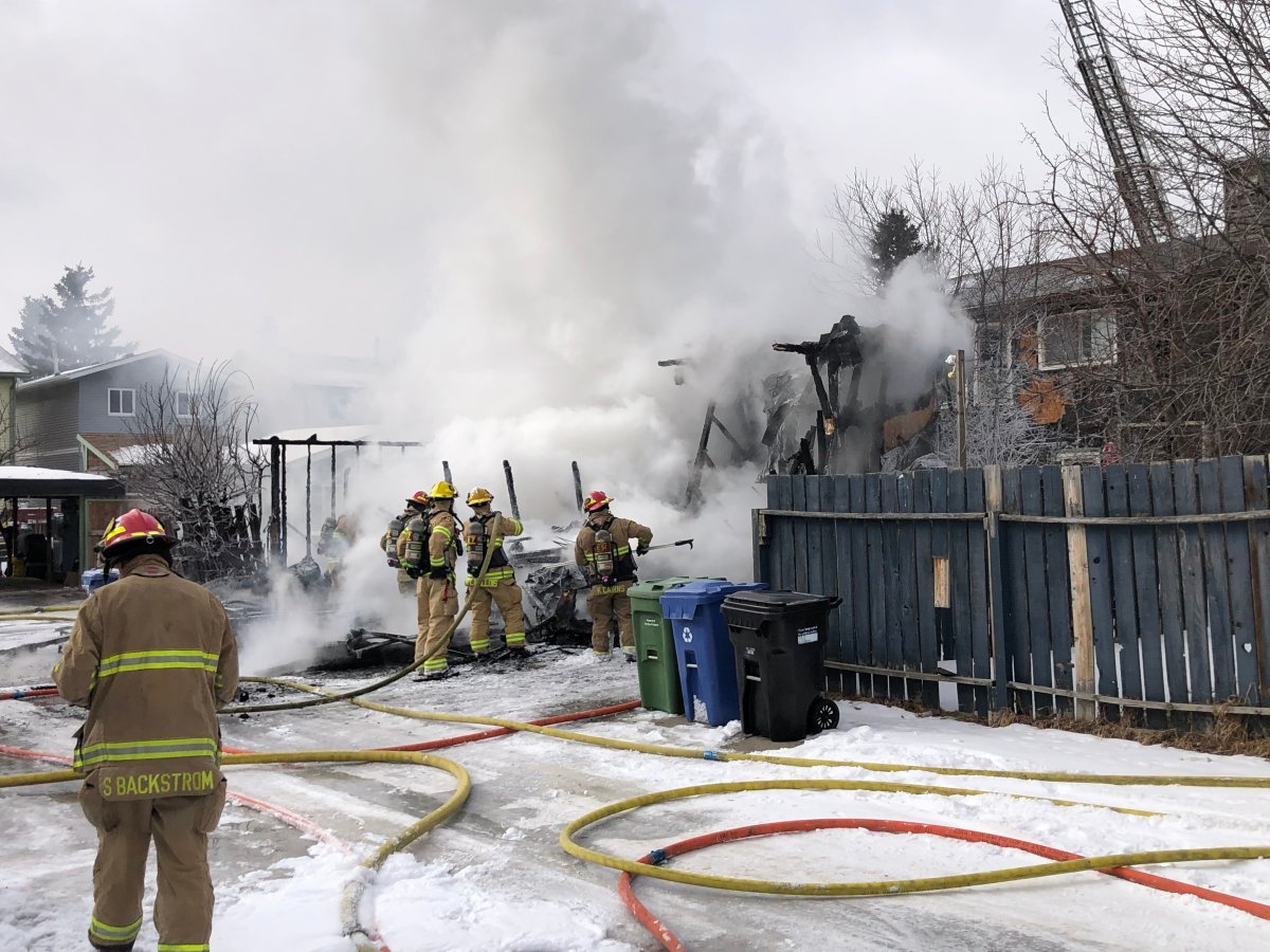Calgary firefighters work to put out a garage fire in Taradale on March 9, 2022.