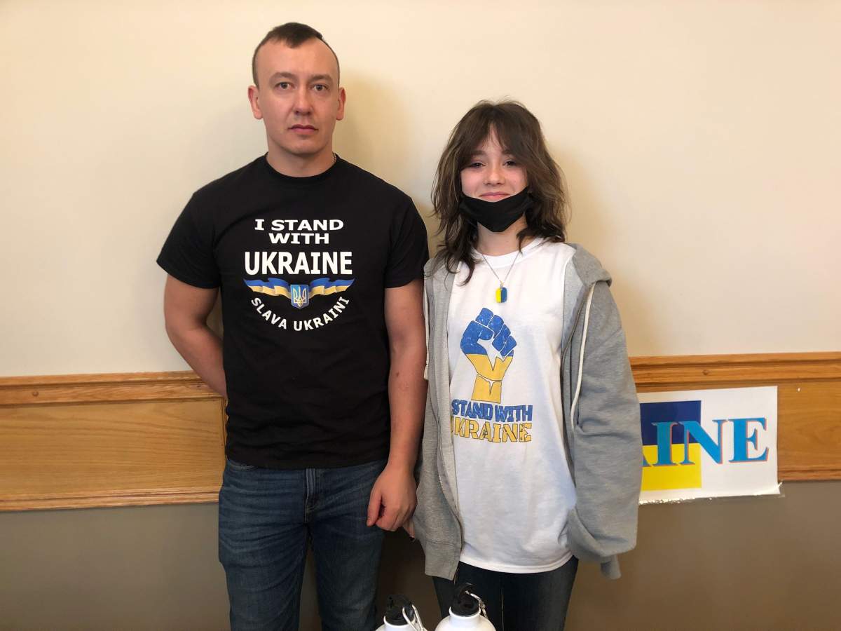 People selling t-shirts at the Support Ukraine event at Polish Combatants Association Hall. March 27, 2022