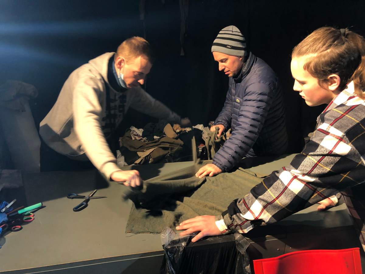 Volunteers turn old clothing and bedsheets into camouflage nets in Lviv, Ukraine, March 6, 2022.