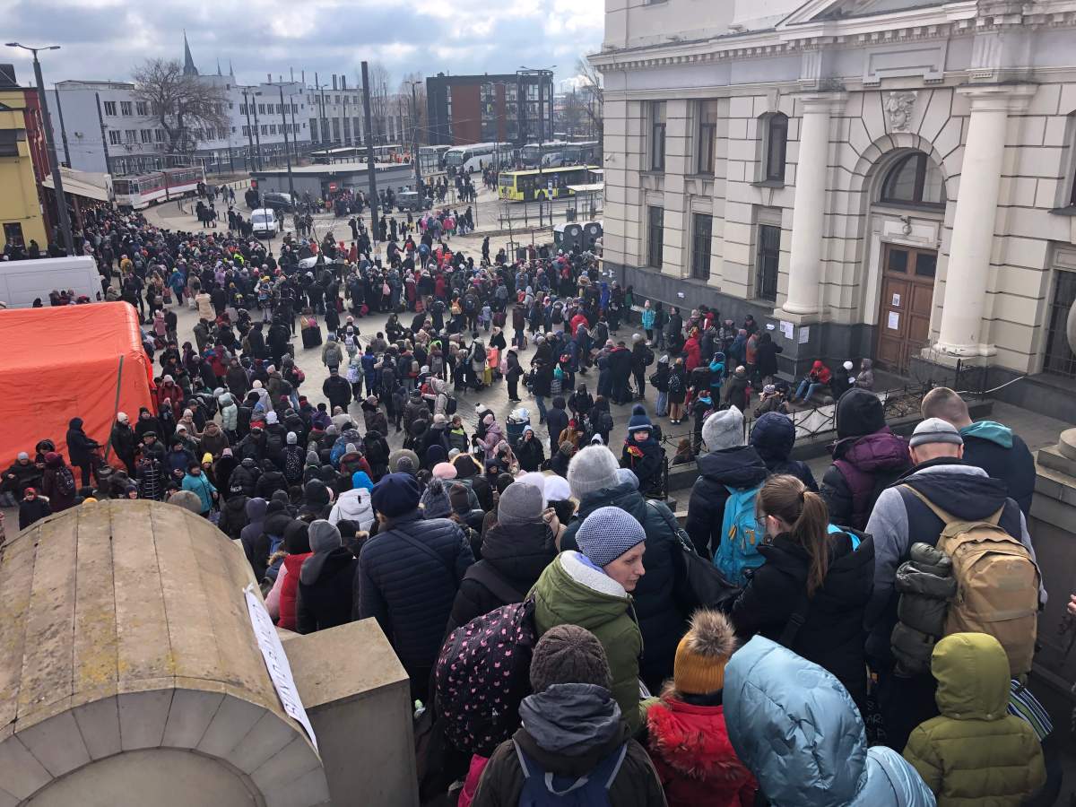 Passengers descend from the platform at Ukraine’s Lviv Railway Station, March 8, 2022