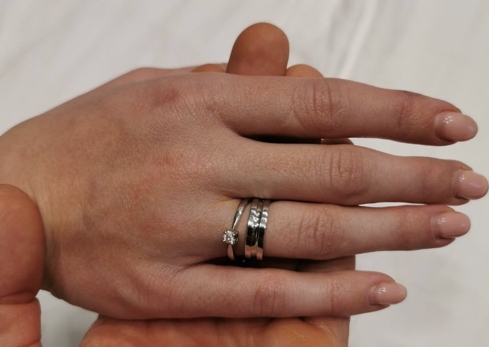 Yulia Khobodin shows her wedding ring following bomb shelter wedding in Dnipro, Ukraine.