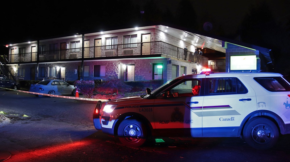 Police on scene at the Highway Hotel in Langley, where a man died in a suspected homicide Friday night. 