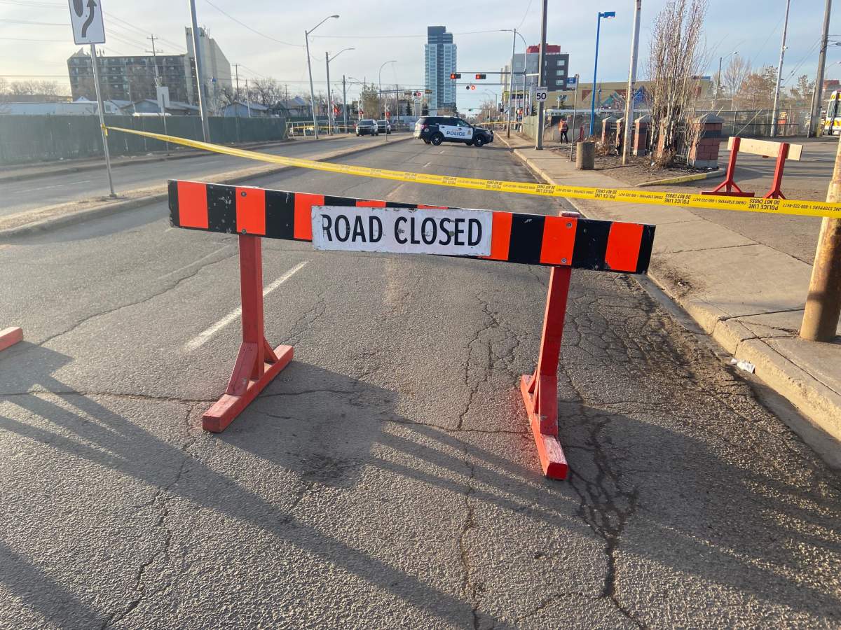 Edmonton police on scene of an incident at the 95 Street LRT crossing north of 105 Avenue Friday, March 25, 2022.