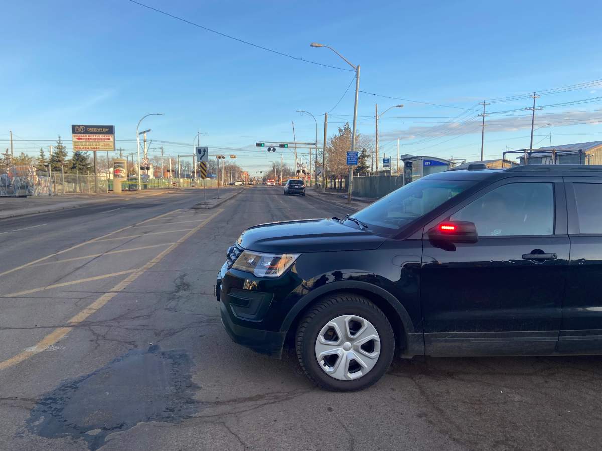 Edmonton police on scene of an incident at the 95 Street LRT crossing north of 105 Avenue Friday, March 25, 2022.