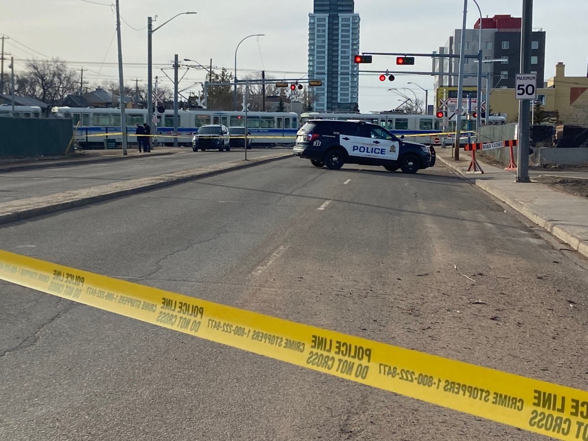 Edmonton police on scene of an incident at the 95 Street LRT crossing north of 105 Avenue Friday, March 25, 2022.