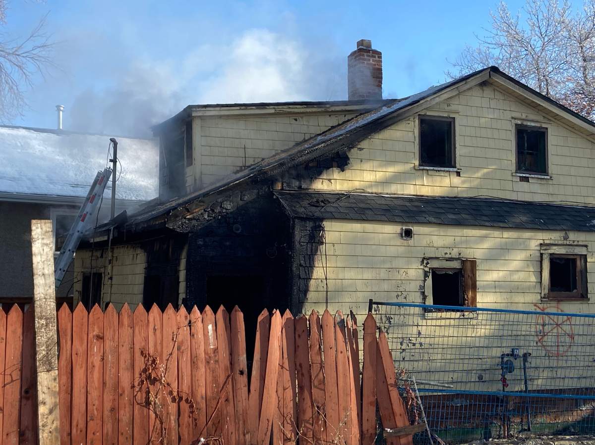 Edmonton firefighters battle a blaze at a property in the area of 97 Street and 111 Avenue Tuesday, March 29, 2020.