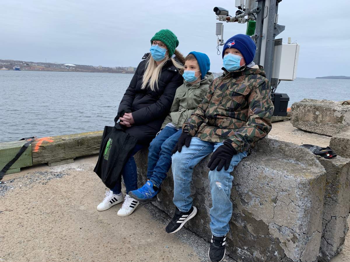 Megan Ellis is seen with her two sons Clifton and Lincoln at the deployment of HMCS Halifax on March 19, 2022.
