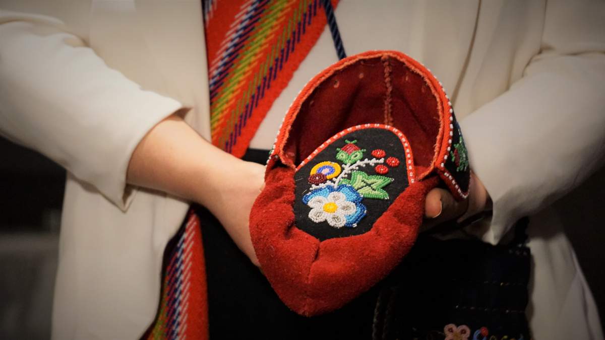 Métis National Council President Cassidy Caron shows off the stunning moccasins gifted to Pope Francis on Mon. March 28, 2022, beaded by Métis delegate Mitchell Case.