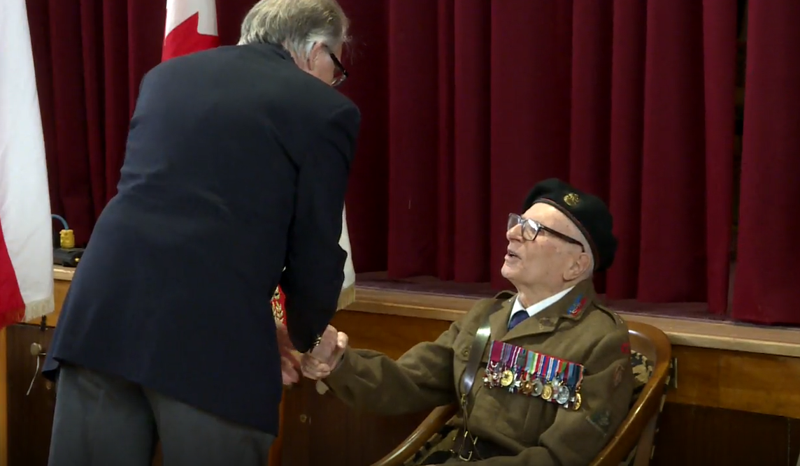 World War Two veteran Stefan Olbrecht greeting members of the Polish community in Winnipeg on Saturday.