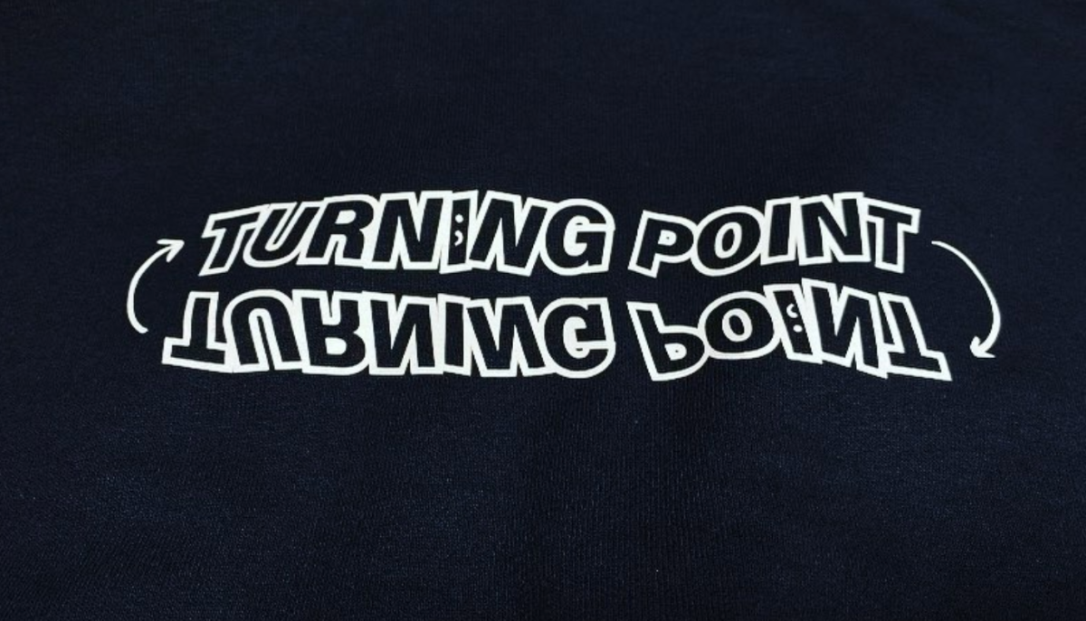 Turning Point logo that can be found on their signature sweatshirts.