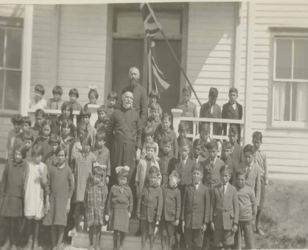 The children and staff of the Grouard Indian Residential School.
