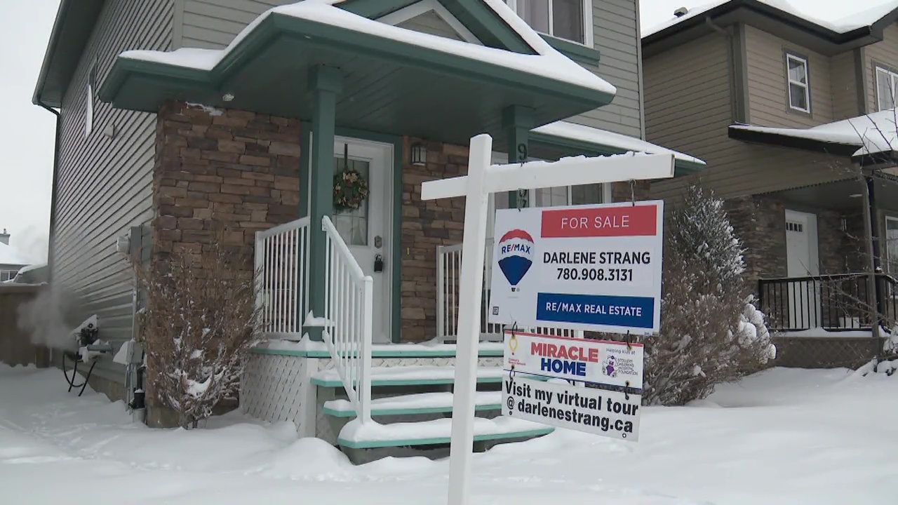 A realtor's sign outside a home for sale in south Edmonton in March 2022.