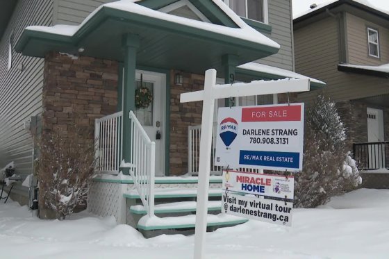 A realtor's sign outside a home for sale in south Edmonton in March 2022.