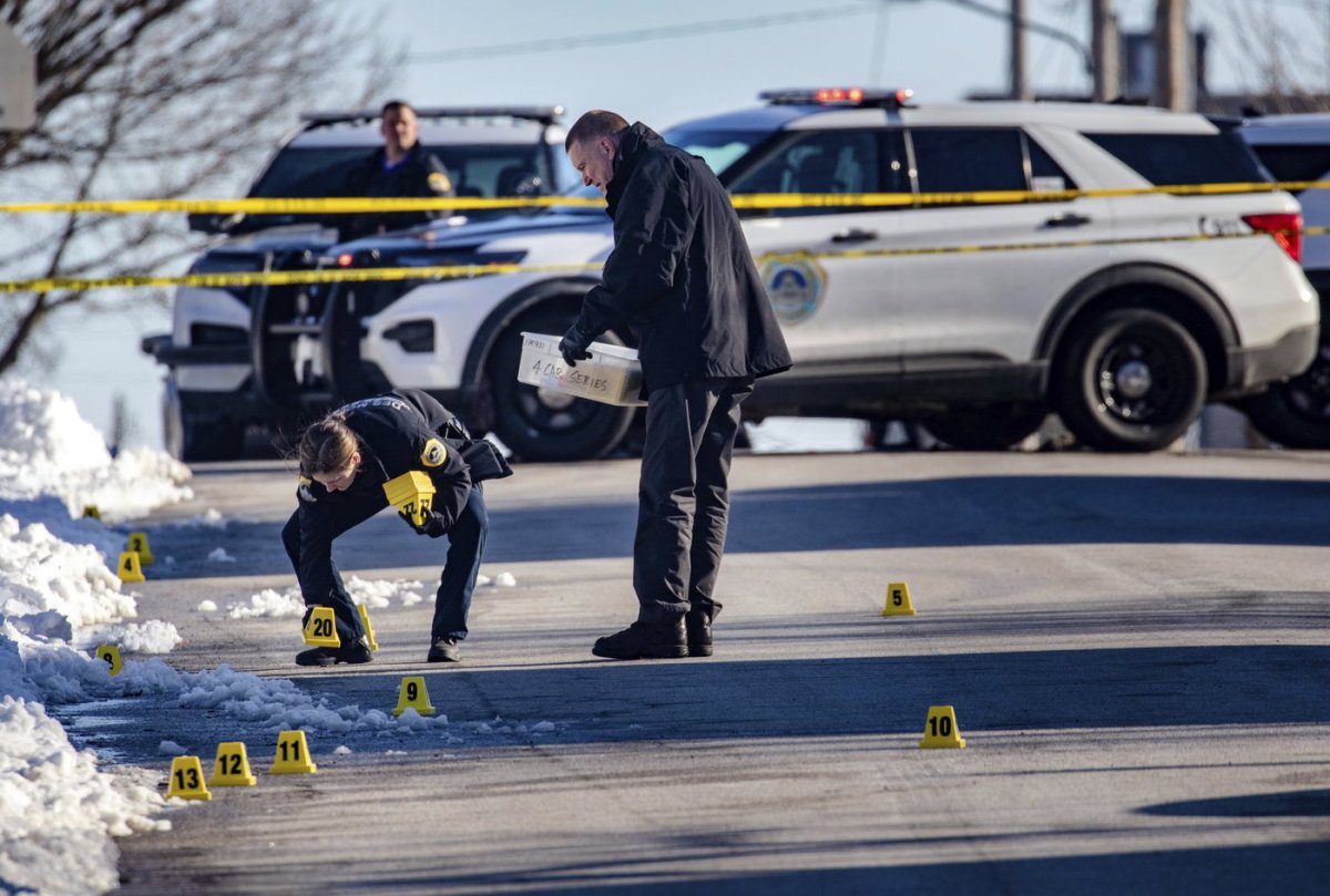Police investigate a shooting outside of East High School in in Des Moines, Iowa, on Monday, March 7, 2022. (Zach Boyden-Holmes/The Des Moines Register via AP).