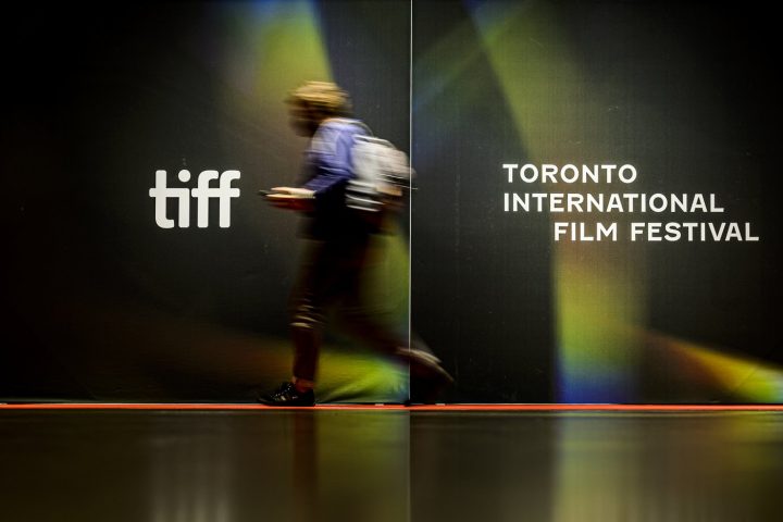 People walk past the Bell Lightbox during the 2021Toronto International Film Festival, Friday, Sept. 10, 2021. The Toronto International Film Festival says organizations, delegations and media outlets supported by the Russian state are not welcome at this year's edition. 