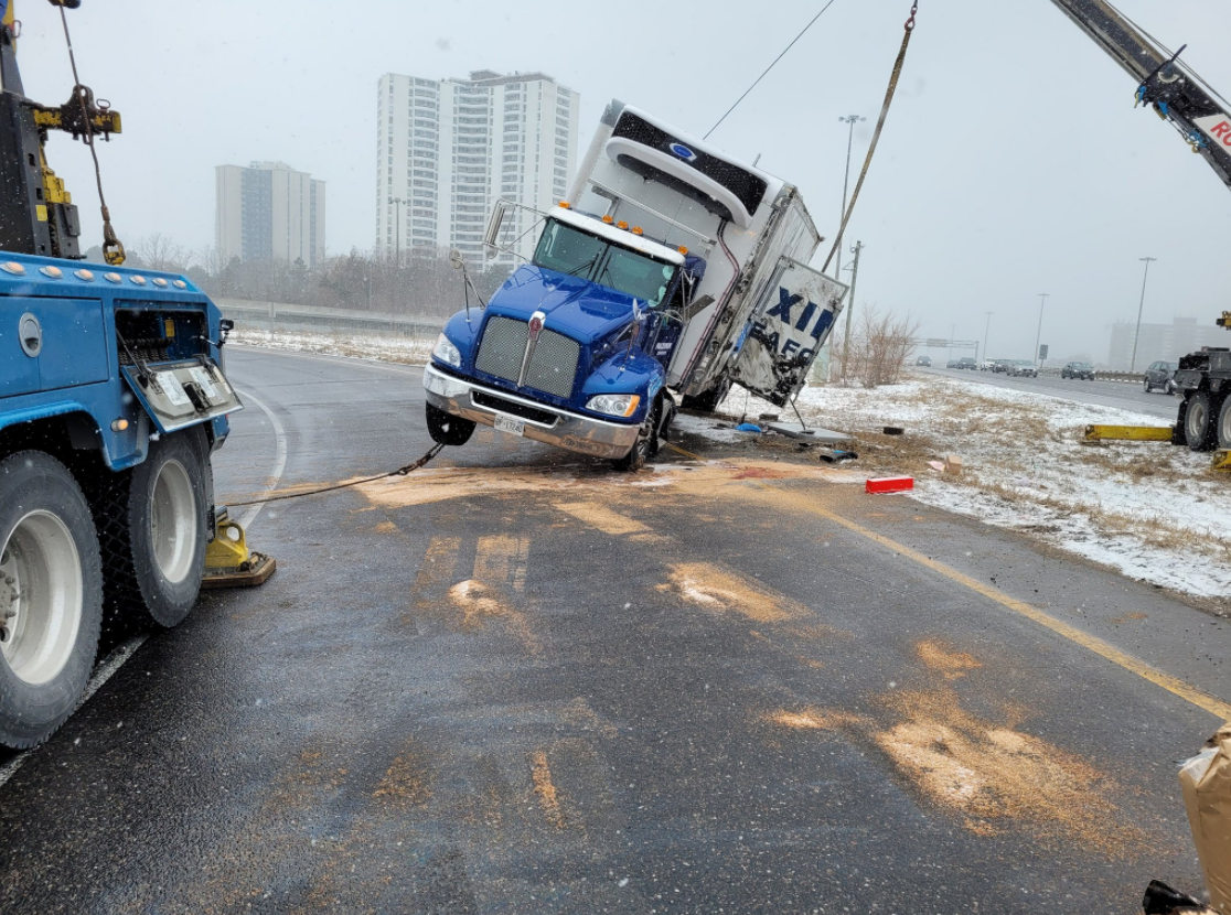 OPP are investigating after a transport truck carrying live fish rolled over on Highway 404.