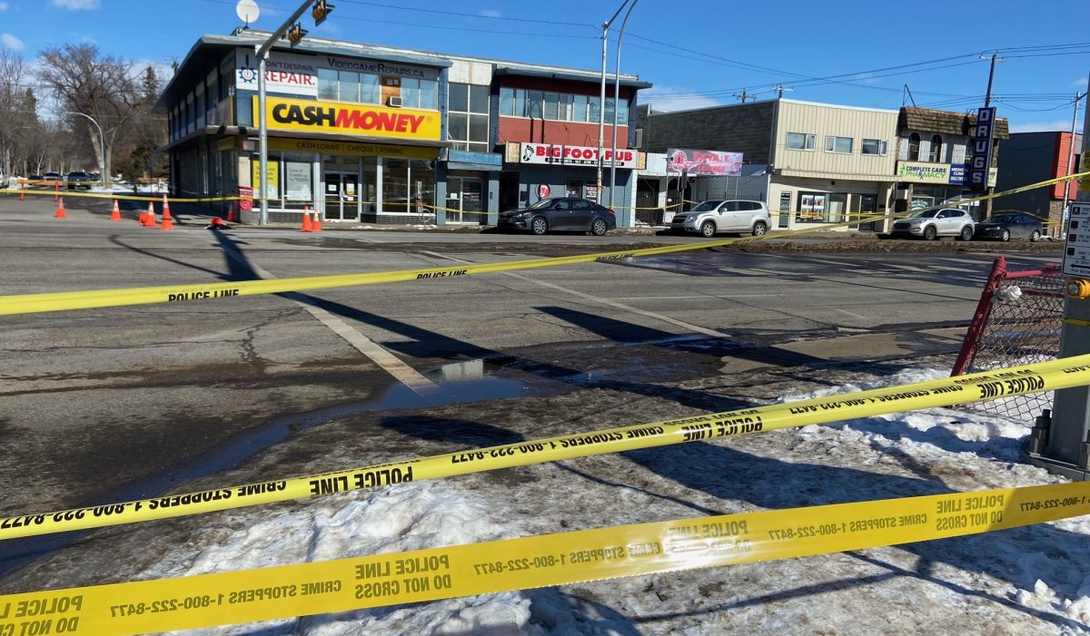 Police tape surrounds businesses on 118 Avenue in Edmonton as EPS investigate a homicide on March 12, 2022.