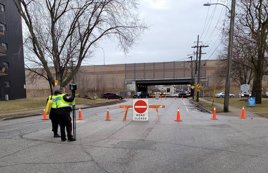 Sarnia police officers investigate the scene of a collision involving a pedestrian and a vehicle on Wednesday morning.