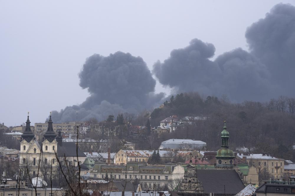 Smoke rises in Lviv, western Ukraine, Saturday, March 26, 2022. (AP Photo/Nariman El-Mofty)