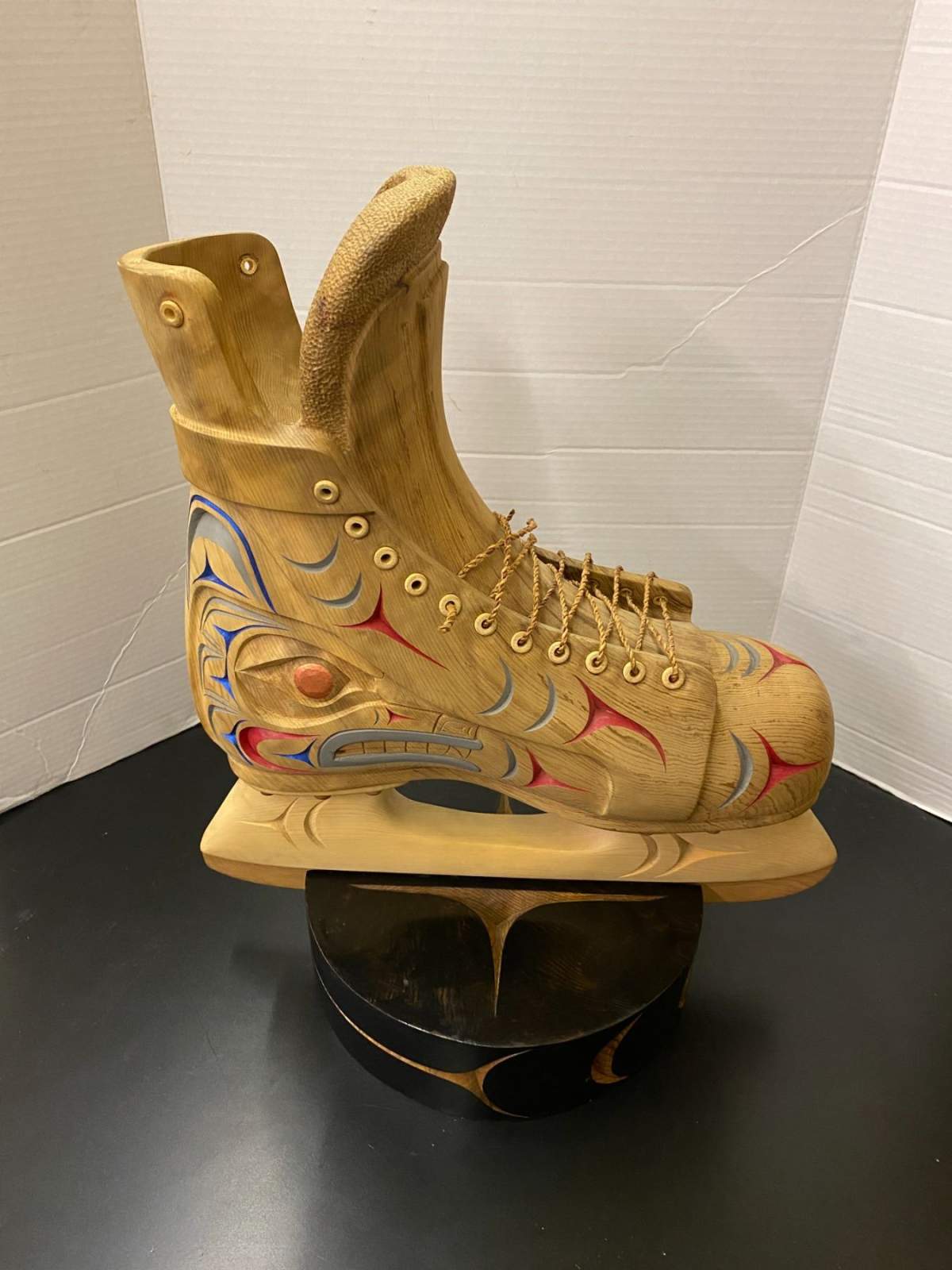 Musqueam Coast Salish artist Chris Sparrow added Indigenous bear and wolf designs on the hockey skate.