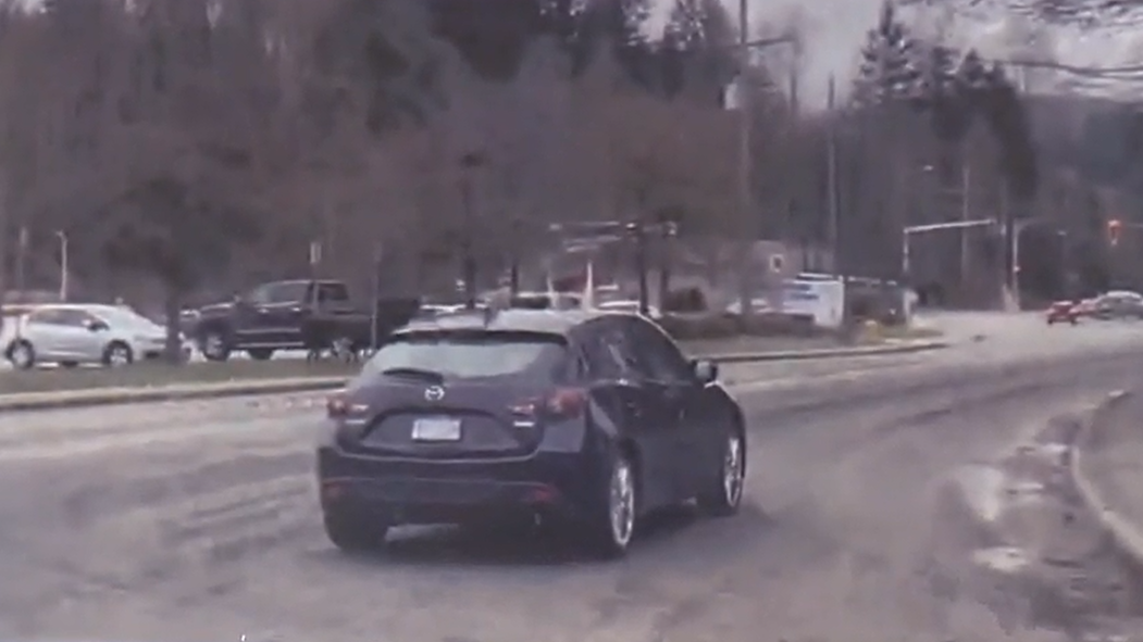 North Vancouver police and firefighters located the suspect vehicle, a dark blue Mazda 3, on fire in the 300-block of Tempe Crescent on March 12, 2022.