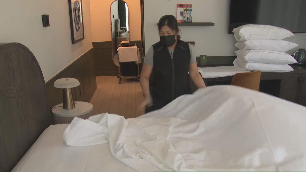 File: Housekeeping staff at The Westley hotel clean the room prior to guest arrival on March 15, 2022.