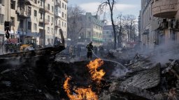 A fire burns on the streets of the Ukrainain city of Kharkiv after a Russian rocket attack.