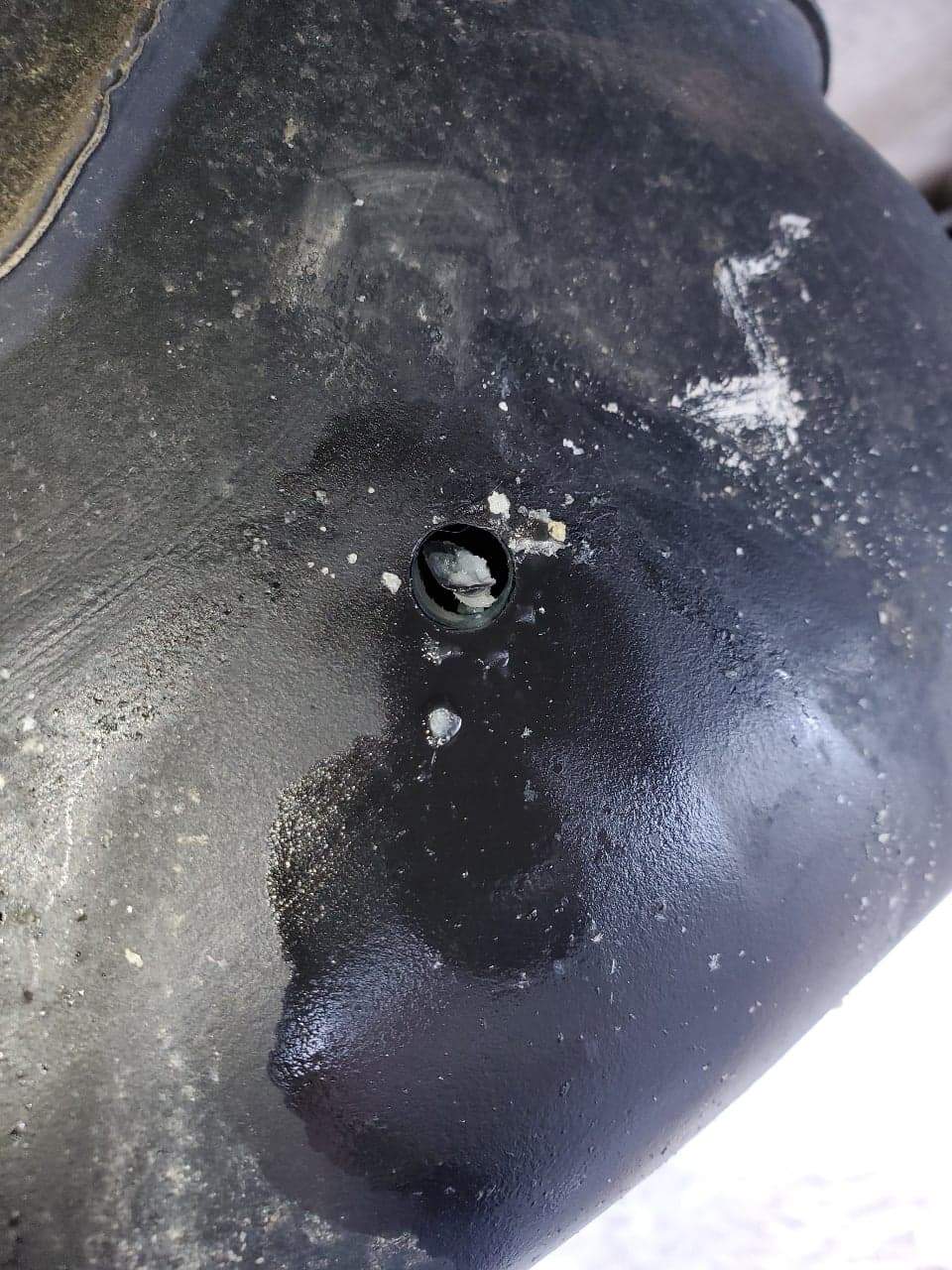 A hole in a van’s gas tank.