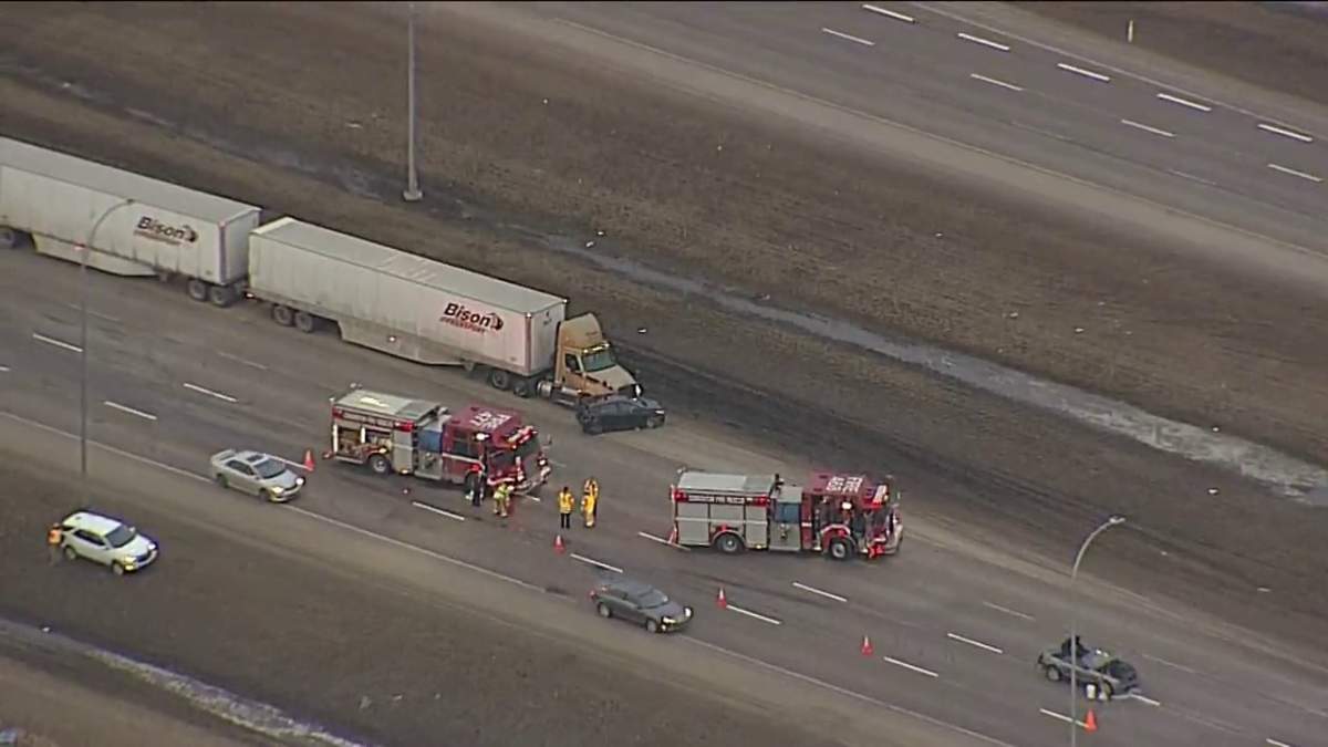 Edmonton police investigate a three-vehicle collision along the west leg of Anthony Henday Drive south of 100 Avenue Wednesday, March 23, 2022.