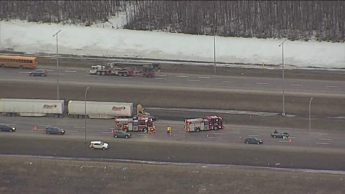 Edmonton police investigate a three-vehicle collision along the west leg of Anthony Henday Drive south of 100 Avenue Wednesday, March 23, 2022.