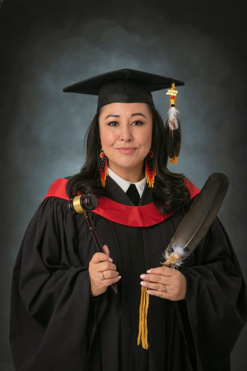 Anita Cardinal-Stewart posting for her graduation picture, after finishing law school at the University of Alberta.
