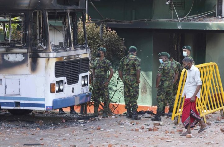 Sri Lankan police commandos inspect the vandalised neighbourhood of Sri Lankan president Gotabaya Rajapksa's private residence, following overnight clashes in Colombo, Sri Lanka, Friday, April 1, 2022. 