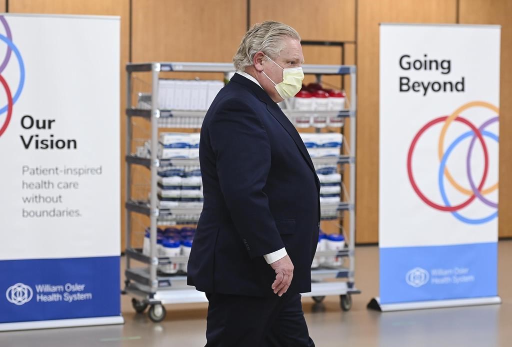 Ontario Premier Doug Ford hold a press conference after visiting the William Osler Health System - Peel Memorial Centre for Integrated Health and Wellness during the COVID-19 pandemic in Brampton, Ont., on Friday, March 26, 2021. THE CANADIAN PRESS/Nathan Denette.