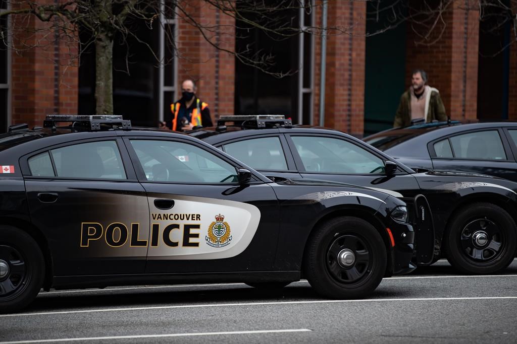 Police cars are seen parked outside Vancouver Police Department headquarters in Vancouver, on Saturday, Jan. 9, 2021.
