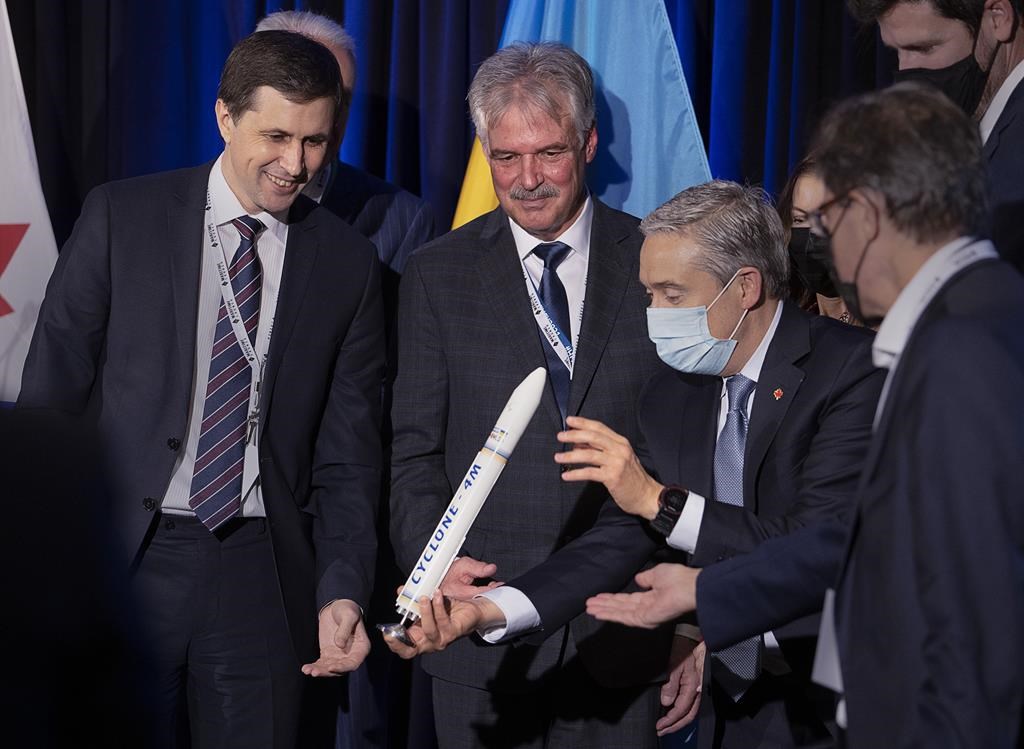 Volodymyr Taftai, head of Ukraine's state space agency, Stephen Matier, president and CEO of Maritime Launch Services, and Francois-Philippe Champagne, minister of innovation, science and industry, left to right, display a model of the Cyclone 4M rocket in Halifax, on Friday, Nov. 19, 2021. The company planning to build Canada's first spaceport in northeastern Nova Scotia says the war in Ukraine has so far not affected its chosen supplier of medium-range rockets. THE CANADIAN PRESS/Andrew Vaughan.