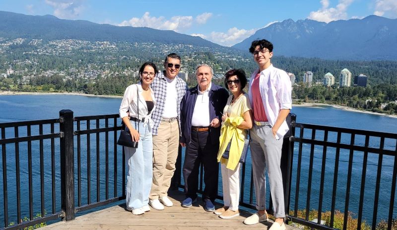 Ali Movassagh (second from left) is seen with his children and parents in Vancouver on Aug. 29, 2021.