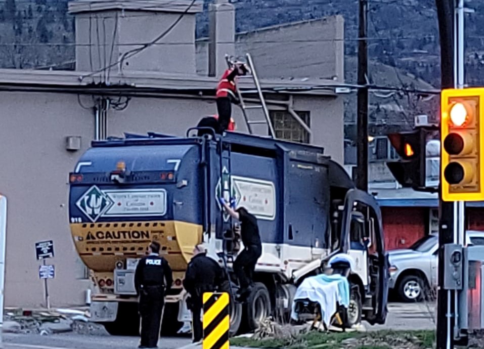 The incident happened in downtown Penticton. Crews arrived on scene shortly after to extract the man from inside the recycling truck.