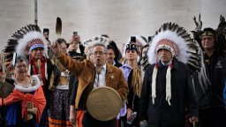 Delegation leader and Dene National Chief Gerald Antoine (centre) leads a procession out of Vatican City on April 1, 2022, after Pope Francis issued a historic apology related to residential schools in Canada. He is flanked by residential school survivors Adeline Webber and Phil Fontaine.