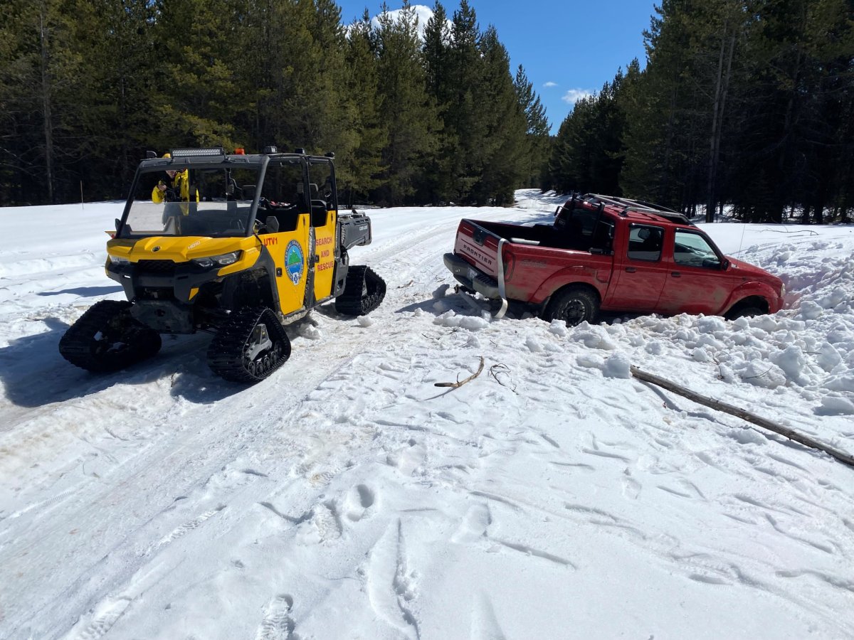 COSAR said it rescued two people on Wednesday morning after their truck got stuck in the hills above East Kelowna.